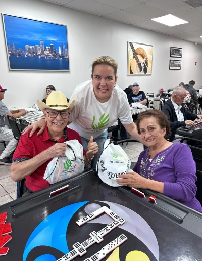 Seniors playing dominoes during recreational activities at Social Center Adult Day Care in Hialeah